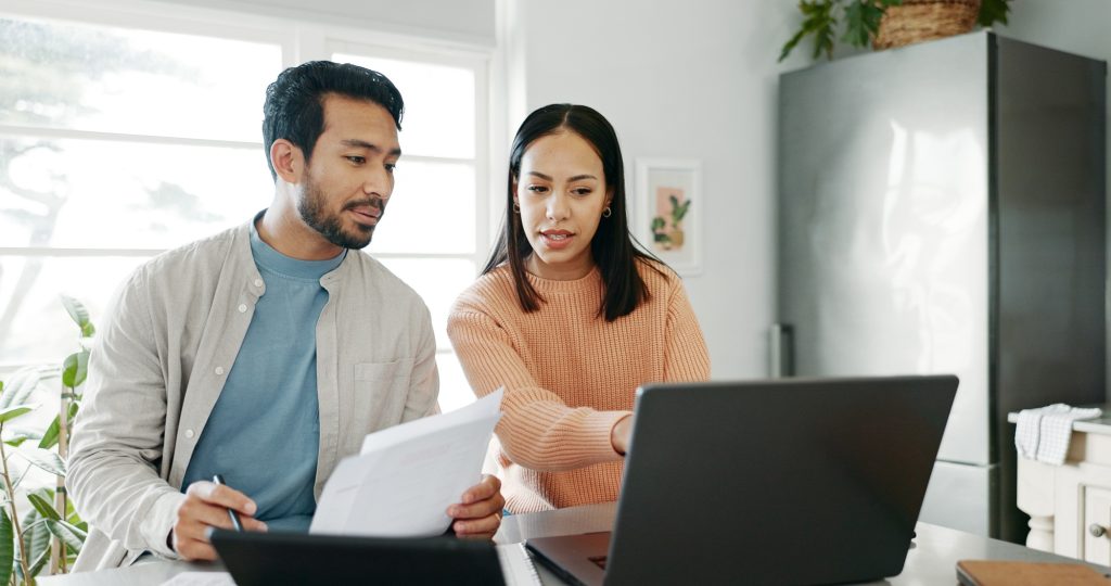 Happy couple, paperwork and technology for savings, paying bills or estate planning. Married people